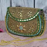 Gold-embroidered handbag with sling strap and multiple decorative elements