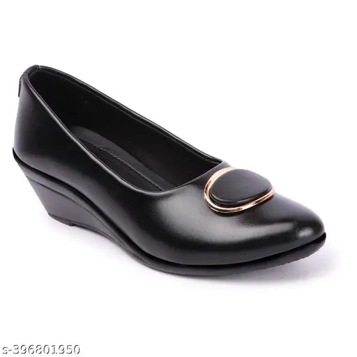 Black synthetic leather bellies shoes for women and girls - soft memory foam, lightweight, breathable faux leather uppers, suitable for casual, formal, and partywear. Comfortable step-in feel with extra cushioning. Durable design complements both ethnic and western wear. Made in India
