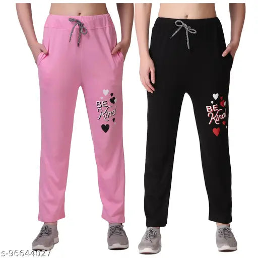Pink and black pyjamas with the message "Be Kind" in hearts on them, pack of 2