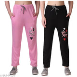 Pink and black pyjamas with the message "Be Kind" in hearts on them, pack of 2