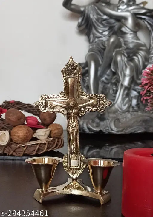 Golden brass Christian cross idol with attached candle stand, antique finish for prayer and worship decor" (123 characters)