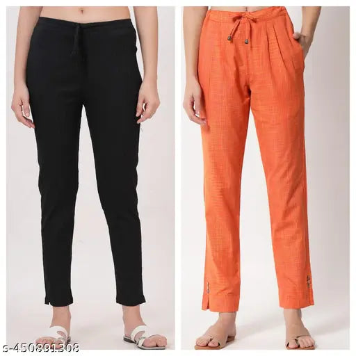 Black cropped trousers, orange wide-leg trousers