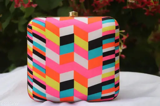Vibrant multi-colored patterned clutch bag with a gold zipper