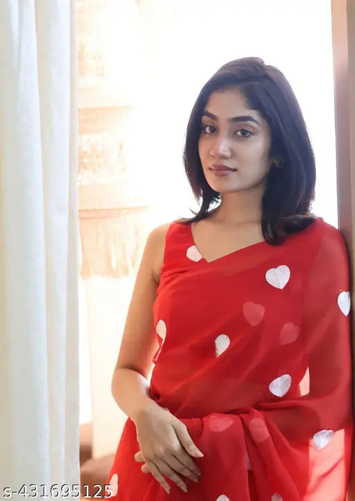 Red georgette saree with heart pattern design