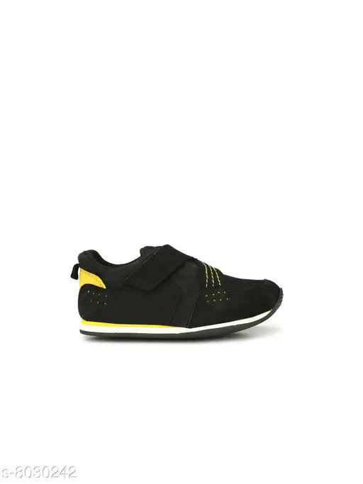 Black Tuskey boys sneakers with yellow accents