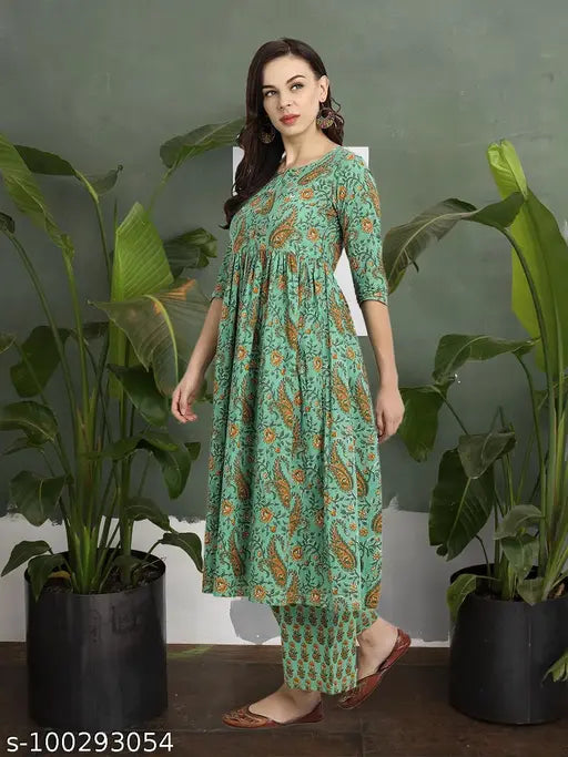 Green cotton causal Kurta set with printed palazzos, round neck, pompom detailing. Indian kalamkari-printed women's outfit