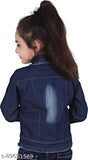 Little girl wearing a denim jacket with an iron on it