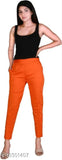 Orange cotton lycra regular-slim fit casual trousers for women, available in various sizes from XS to 3XL. Comfortable and versatile pants for traditional or casual functions, perfect for pairing with solid color kurtas. Designed in India
