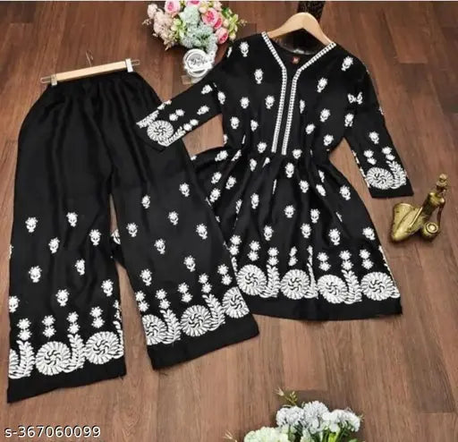 Black embroidered rayon kurti pants set, featuring short kurti with palazzo bottoms. Traditional Pakistani ensemble for festive events or weddings