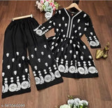 Black embroidered rayon kurti pants set, featuring short kurti with palazzo bottoms. Traditional Pakistani ensemble for festive events or weddings