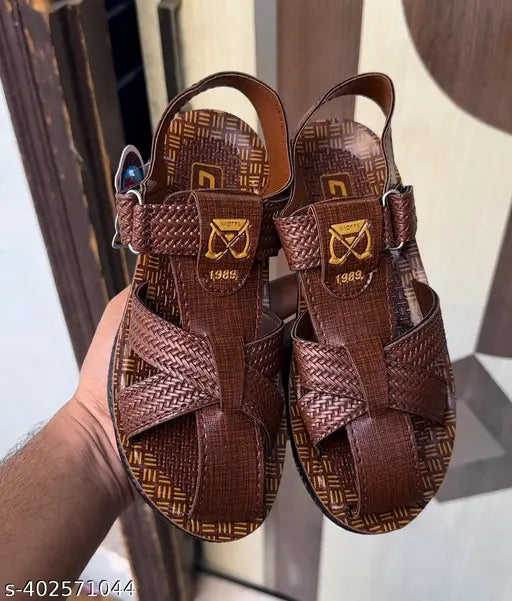 Brown woven leather sandal with black straps and buckle