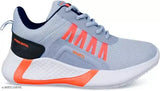 Grey sports sneakers with orange accents, designed for kids and boys