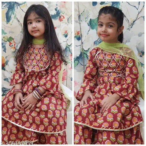 Cotton Anarkali Kurti Sharara Set with Net Dupatta, printed floral design and Gota work. Knee-length top paired with sharara bottom featuring elastic waistband. Vibrant colors for traditional ethnic wear in comfortable cotton. Sizes: 4-5Y (24in), 5-6Y (26in), 6-7Y (28in), 8-9Y (32in), 9-10Y (32in). Mother-daughter combo available, Made in India