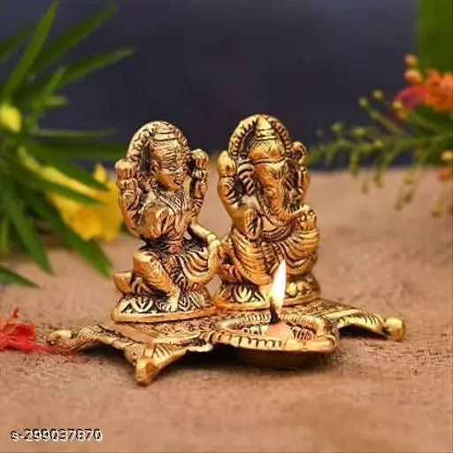 Metal Ganesh-Laxmi Diya idol set for home, temple, office & gifting, signifying luck, happiness & prosperity. Dimensions: 15x11x10 cm. Made in India