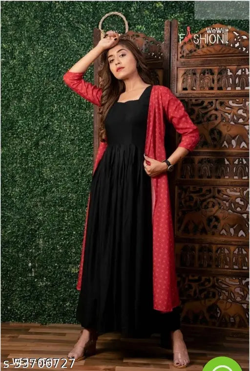 Black rayon saree with printed design, long pallu, fitted blouse and stylish neck