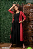 Black rayon saree with printed design, long pallu, fitted blouse and stylish neck