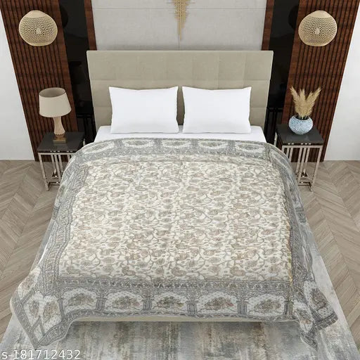 Cream-colored heavy ultrasoft satin blanket with gold allover print, featuring Rajasthani Jaipuri design. Ideal for use as a comforter, duvet or quilt, measuring 152cm x 228cm