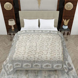 Cream-colored heavy ultrasoft satin blanket with gold allover print, featuring Rajasthani Jaipuri design. Ideal for use as a comforter, duvet or quilt, measuring 152cm x 228cm