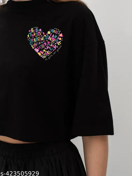 Trendy pink heart print black cotton three-quarter sleeve crop tops with crew neck and loose fit, perfect for women's and girls' casual summer wear