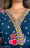 The image displays a long sleeved dark blue dress featuring intricate floral embroidery in yellow, white and red on the chest and upper front area. The dress appears to have a V-neckline and is likely made of georgette fabric, given its name