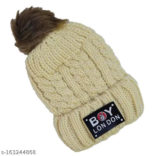 Brown wool beanie with a soft pompom and fur lining