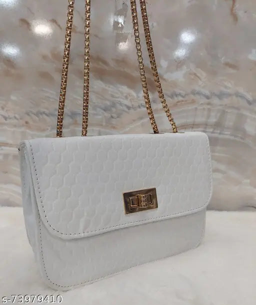 Cream designer slingbag with metallic gold chain, logo embossed on leather