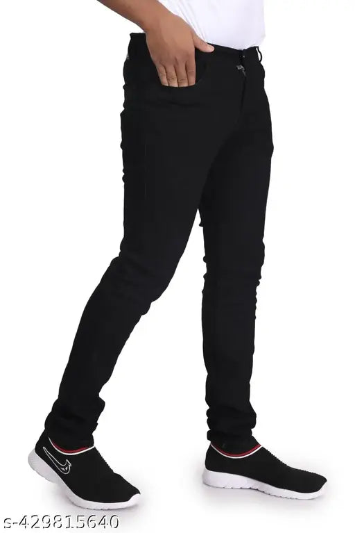 Stylish black cotton blend denim jeans for men, slim fit and full length with solid pattern, on model standing