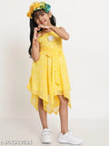 A young girl wearing a yellow sleeveless wedding dress, standing in front of a white background