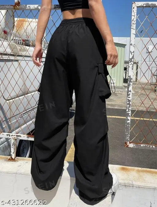 Black high waisted trousers with pockets, side zip fly