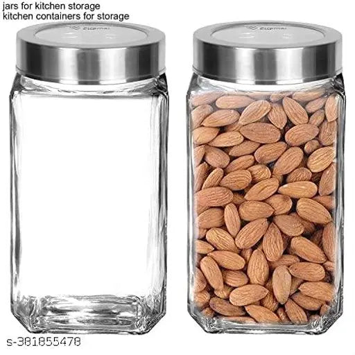 Transparent glass jar with silver lid, filled with almonds, kitchen storage container