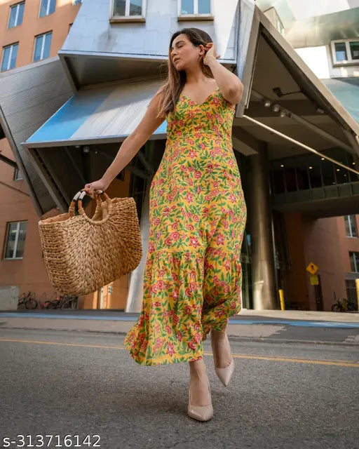Vibrant yellow rayon kurta for women, sleeveless and printed net design. Sizes: S-XXXL, origin: India