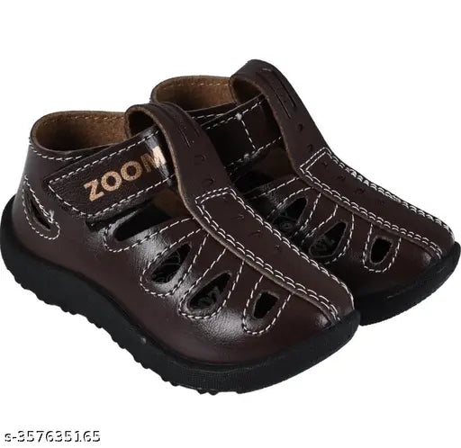 Stylish sandals for kids, suitable for daily wear, featuring a comfortable design for ages 9 months to 55 years. These sandals are available in brown and are suitable for both boys and girls
