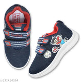 Blue casual sport shoes for kids. Soft fabric with red trim and velcro closure. Perfect for everyday play and sports activities