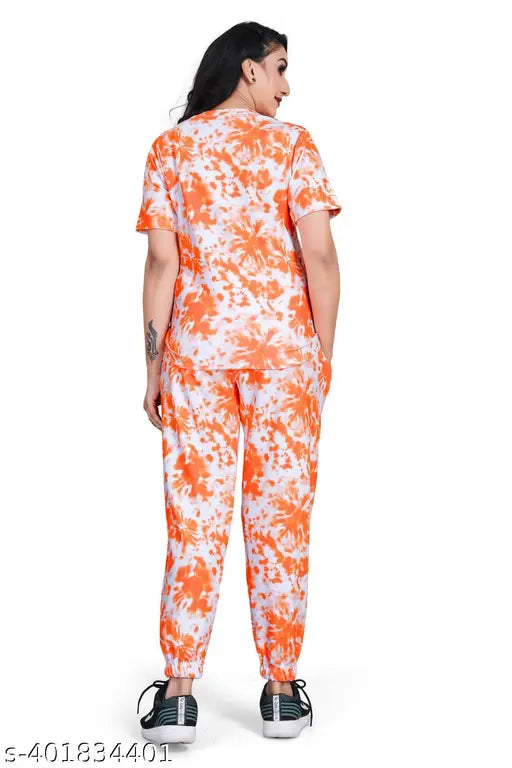 Orange cotton-blend co-ord set with printed multi-color design, featuring a t-shirt top and trouser pants for women. Traditional ethnic style, perfect for summer or winter wear. Indian origin