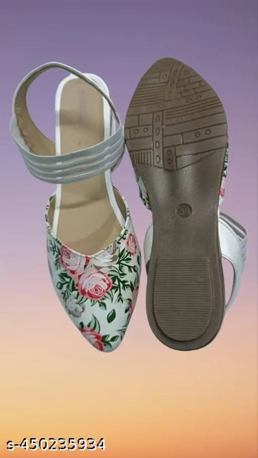 Black leather slippers with floral detailing