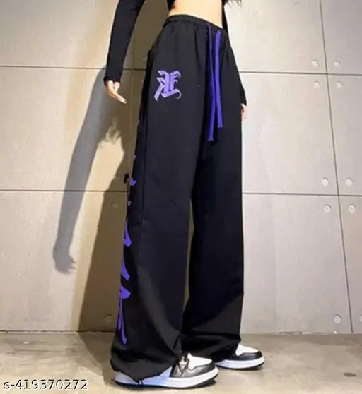 A woman wearing stylish joggers with a visible purple logo