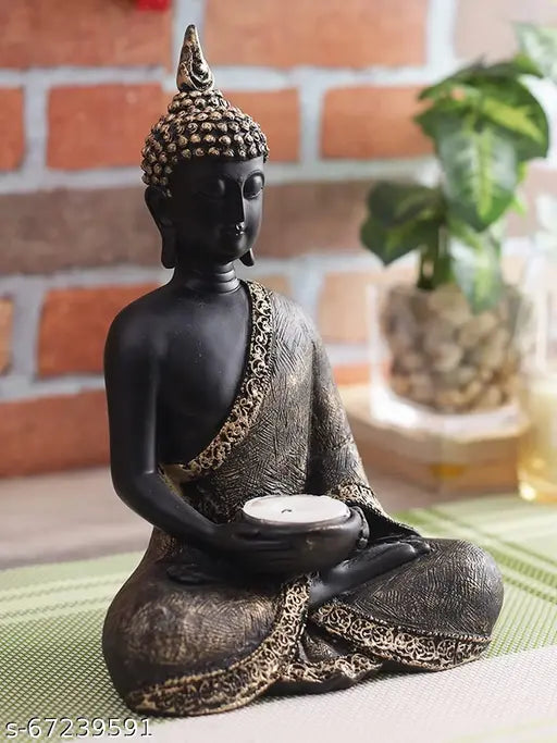 Black metal statue of a sitting Buddha holding a tealight candle, serves as a decorative shelf or stand