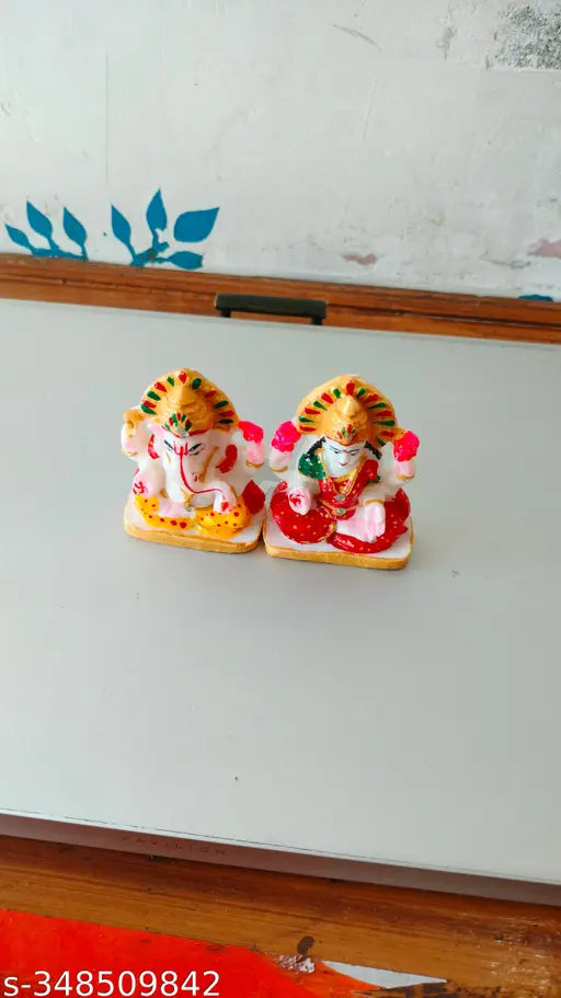 Handcrafted marble Ganesha idol in vibrant colors, intricate designs, 15cm x 9cm