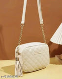 Trendy white quilted womens slingbag with shoulder strap and tassel detail