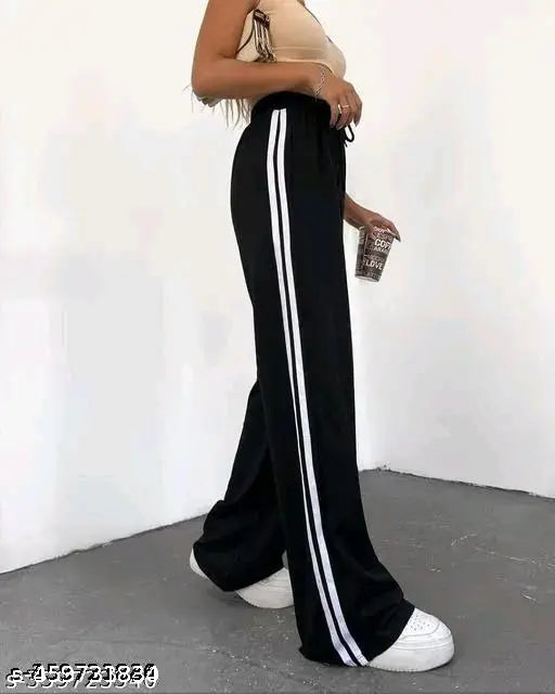Fashionable woman in high waist striped pants