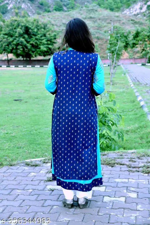 Blue kurta, long sleeve, buttoned up, standing on grass