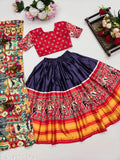 Printed acrylic and satin lehengha choli for girls aged 5 to 10 years, featuring short sleeves, Ikat pattern, and stitched net. Indian handcrafted traditional attire on display