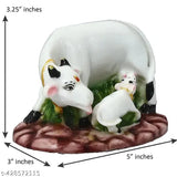 White and Green Kamdhenu Cow with Calf Statue - Polyresin Handicraft, ideal for spiritual or personal gifts