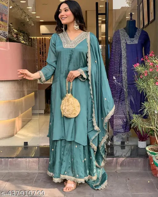 Blue silk kameez with dupatta in a store display
