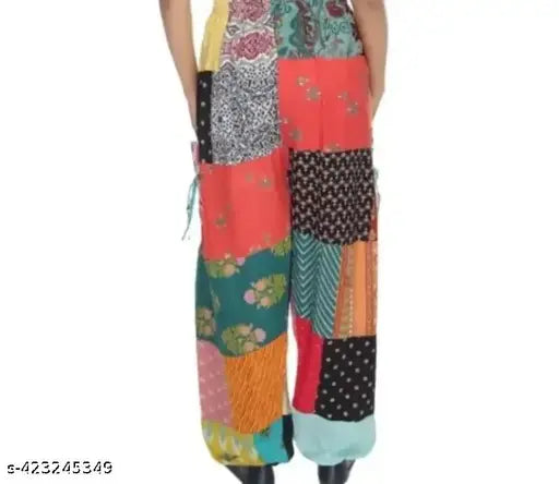 Multi-colored patchwork wide leg harem pants with drawstring waistband, likely cotton or linen material