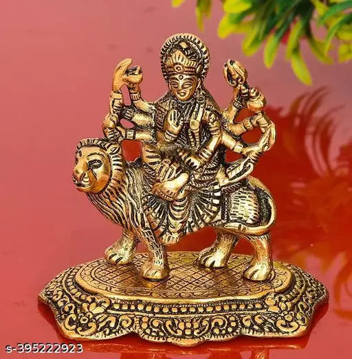 Golden metal Goddess Maa Durga Sherawali Mata idol on lion for home decor or office table, 12cm length