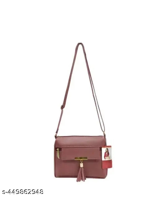 Purple leather sling bag with tassel closure, shoulder strap