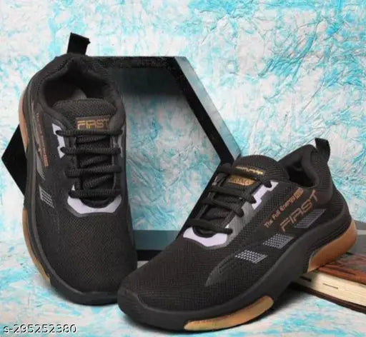 Dark sports shoes for boys with white and tan accents, black laces
