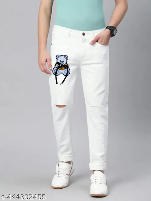White distressed denim pants, bear graphic on knee