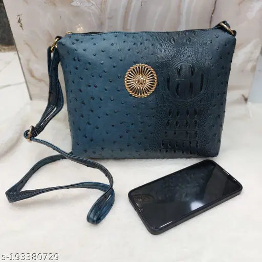 Croc-patterned shoulder bag for women, featuring a circular embellishment on strap, crafted from high-quality materials